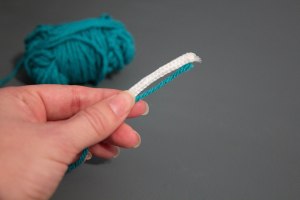 An image of the beginning of a coiled rope and yarn coaster. 
